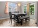 A dining room featuring tile floors, a black dining set, and sliding glass doors to the exterior at 218 Austin Creek Ct, Summerville, SC 29483