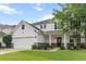Charming two-story home featuring a two-car garage, well-manicured lawn, and welcoming front porch at 218 Austin Creek Ct, Summerville, SC 29483