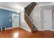 Inviting foyer with hardwood floors, chandelier, and staircase leads to the upper level of the home at 218 Austin Creek Ct, Summerville, SC 29483
