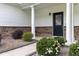 The front entry features stone accents, a black door, and manicured landscaping at 218 Austin Creek Ct, Summerville, SC 29483