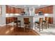 A kitchen with wooden bar stools, stainless steel appliances and wood cabinets at 218 Austin Creek Ct, Summerville, SC 29483