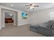 Living room with a gray couch, carpet floors, and a TV on the wall at 218 Austin Creek Ct, Summerville, SC 29483