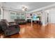 Inviting living room features a fireplace, plush furniture, hardwood floors, and a ceiling fan at 218 Austin Creek Ct, Summerville, SC 29483