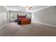 The main bedroom featuring a large bed, ceiling fan, and ample natural light at 218 Austin Creek Ct, Summerville, SC 29483
