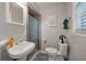 Cozy bathroom with a classic white sink, a toilet, and a walk-in shower, creating a functional and clean space at 2220 Pinehurst Ave, Charleston, SC 29414