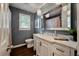 Stylish bathroom features a white vanity with marble countertop, an ornate mirror, and modern lighting fixtures at 2220 Pinehurst Ave, Charleston, SC 29414