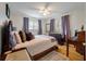 Comfortable bedroom with soft lighting, plush bedding, and hardwood floors, creating a relaxing and inviting atmosphere at 2220 Pinehurst Ave, Charleston, SC 29414
