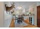 Elegant dining room with wood flooring, charming decor, and direct access to the well-appointed kitchen at 2220 Pinehurst Ave, Charleston, SC 29414