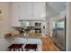 Charming kitchen with granite countertops, stainless steel appliances, and wood flooring at 2220 Pinehurst Ave, Charleston, SC 29414