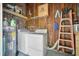 Functional laundry room features a washer, dryer, and ample storage, offering convenience and practicality at 2220 Pinehurst Ave, Charleston, SC 29414