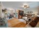 Inviting living room with hardwood floors, a comfortable seating arrangement, and a dining area at 2220 Pinehurst Ave, Charleston, SC 29414