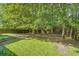 An expansive backyard enclosed by a wooden fence, providing privacy and a safe play area at 240 Eagle Ridge Rd, Summerville, SC 29485
