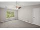 Vaulted ceiling bedroom featuring a ceiling fan, large window, and neutral carpeting at 240 Eagle Ridge Rd, Summerville, SC 29485
