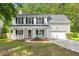 Charming two-story home featuring a welcoming front porch, well-maintained lawn, and attached garage at 240 Eagle Ridge Rd, Summerville, SC 29485