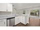 Modern kitchen features granite counters, stainless appliances, and a view of the backyard at 240 Eagle Ridge Rd, Summerville, SC 29485