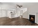 View of open-concept living room featuring wood-look floors, a fireplace, and a ceiling fan at 240 Eagle Ridge Rd, Summerville, SC 29485