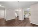 Open-concept living space featuring wood flooring, a staircase, and a view into the adjacent kitchen at 240 Eagle Ridge Rd, Summerville, SC 29485