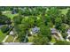 Expansive aerial view of a home surrounded by lush greenery, a golf course, and a serene lake at 25 Fitzroy Dr, Charleston, SC 29414