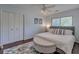 Comfortable bedroom featuring a ceiling fan, ottoman, and a large window for natural light at 25 Fitzroy Dr, Charleston, SC 29414
