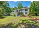 Lovely two-story home featuring a beautiful lawn, mature trees, and welcoming curb appeal at 25 Fitzroy Dr, Charleston, SC 29414