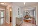 Welcoming hallway leading to a dining room with an elegant chandelier and a stylish bathroom at 25 Fitzroy Dr, Charleston, SC 29414