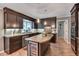Charming kitchen featuring granite countertops, wooden cabinets, stainless steel appliances, and a wine fridge at 25 Fitzroy Dr, Charleston, SC 29414