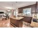 Charming kitchen featuring granite countertops, wooden cabinets, stainless steel appliances, and an island at 25 Fitzroy Dr, Charleston, SC 29414