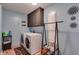 Well-lit laundry room equipped with a washer, dryer, storage cabinets, and a laundry-themed rug at 25 Fitzroy Dr, Charleston, SC 29414