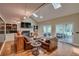 Cozy living room with leather furniture, fireplace, and access to the screened-in porch at 25 Fitzroy Dr, Charleston, SC 29414