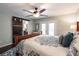 Bright main bedroom with a ceiling fan, ensuite bathroom, and access to the balcony at 25 Fitzroy Dr, Charleston, SC 29414