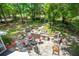 Aerial view of the outdoor kitchen featuring a built-in grill, stone counters, and patio area perfect for entertaining at 25 Fitzroy Dr, Charleston, SC 29414