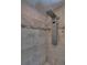Stunning travertine tile in this walk-in shower is appointed with a custom shower fixture at 25 Fitzroy Dr, Charleston, SC 29414