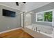 Bathroom featuring a large tub, a shower and a window with nature views at 263 Gator Walk, Ridgeville, SC 29472