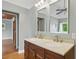 Bathroom featuring double sinks with wooden cabinets at 263 Gator Walk, Ridgeville, SC 29472