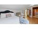 Cozy bedroom with a comfy bed, futon, and closet featuring wooden floor at 263 Gator Walk, Ridgeville, SC 29472