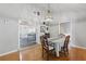 Bright dining room with elegant lighting, table setting, and views to other rooms at 263 Gator Walk, Ridgeville, SC 29472