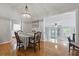 Well-lit dining room with a chandelier, wood floors, and access to living spaces at 263 Gator Walk, Ridgeville, SC 29472