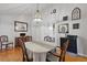 Elegant dining room with a chandelier, classic furniture, and views into adjacent rooms at 263 Gator Walk, Ridgeville, SC 29472