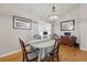 Inviting dining room with chandelier lighting, stylish decor, and wood floors at 263 Gator Walk, Ridgeville, SC 29472