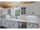 The kitchen features bright white cabinets, a farmhouse sink, and butcher block countertops at 263 Gator Walk, Ridgeville, SC 29472