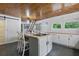 This kitchen features a butcher block island with seating and grey slate flooring at 263 Gator Walk, Ridgeville, SC 29472