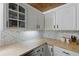 Bright kitchen featuring white shaker cabinets, herringbone backsplash and butcher block counters at 263 Gator Walk, Ridgeville, SC 29472