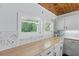 Bright kitchen with white shaker cabinets, herringbone backsplash and butcher block countertops at 263 Gator Walk, Ridgeville, SC 29472
