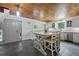 The kitchen features an island with seating, shaker cabinets and butcher block countertops at 263 Gator Walk, Ridgeville, SC 29472