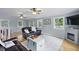 Comfortable living room with a fireplace, natural light, and a stylish white rug at 263 Gator Walk, Ridgeville, SC 29472