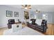 Spacious living room with hardwood floors, comfortable seating, and access to other rooms at 263 Gator Walk, Ridgeville, SC 29472