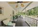 Relaxing porch with ceiling fans, outdoor furniture, and views of the landscaped yard at 263 Gator Walk, Ridgeville, SC 29472