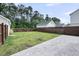 Spacious backyard with a well-maintained lawn, paver patio, and a privacy fence at 2844 Pinelog Ln, Johns Island, SC 29455