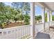 View from the balcony showing white railings and column posts overlooking the neighborhood at 2844 Pinelog Ln, Johns Island, SC 29455