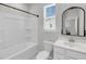 Bright bathroom featuring a shower-tub combination and vanity with an ornate mirror at 2844 Pinelog Ln, Johns Island, SC 29455